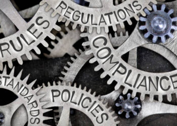 A group of gears with global firms and supply chain shocks written on them, representing the importance of rules, regulations, and compliance in inventory management.