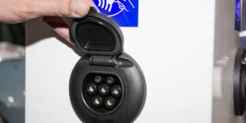 A person inserting a key into an Advanced Voice AI keypad.