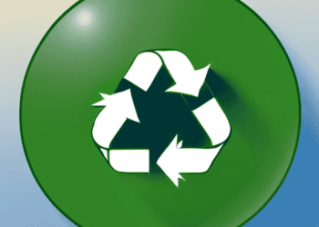 A green button with a recycling symbol on it, designed to raise awareness amongst fashion industry executives about reducing plastic packaging use.