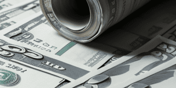 A pile of money with a roll of cash on top representing the U.S. budget deficit for the fiscal year.