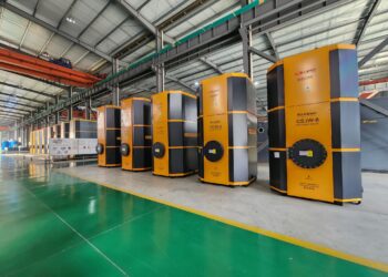 A group of electric boilers in a warehouse.