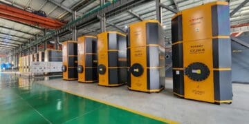 A group of electric boilers in a warehouse.