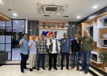 A group of men posing for a photo during an International Trade Council initiative in Indonesia.