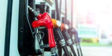 Shell fuel pumps at a gas station facing a decline in profits.