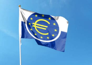 The flag of the European Union waving in the wind, symbolizing unity and cooperation among member states in a time of interest rate adjustments.