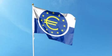 The flag of the European Union waving in the wind, symbolizing unity and cooperation among member states in a time of interest rate adjustments.