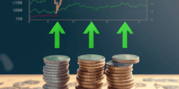 Stacks of coins rising, mirroring upward trending stock market graph. Financial growth. - Supply Chain News