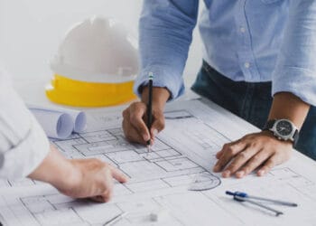 Architects reviewing blueprints for new SEGRO industrial units at Slough Trading Estate. - Supply Chain News