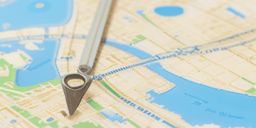 Map with a compass pointing to a location, illustrating geocoding for enhanced risk management in insurance. - Supply Chain News