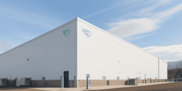 A new advanced cold-storage facility by Lineage Logistics in Hazle Township, showcasing its exterior with a large, modern warehouse design.