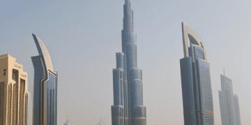 A view of iconic UAE landmarks, including the Burj Khalifa and Abu Dhabi's modern skyline, symbolizing the nation's economic and cultural significance.