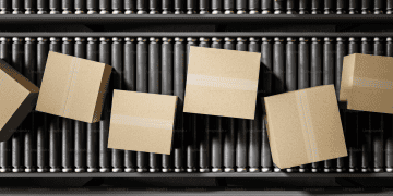 Cardboard boxes on a conveyor belt at TOPACK 2025, India's premier packaging exhibition. - Supply Chain News