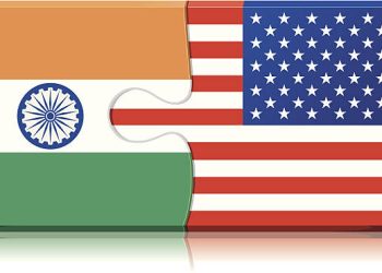 India and US flags as puzzle pieces, symbolizing bilateral trade talks impacted by US tariffs. - Supply Chain News