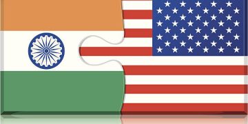 India and US flags as puzzle pieces, symbolizing bilateral trade talks impacted by US tariffs. - Supply Chain News