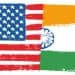 US and India flags merged, symbolizing trade relations. Tariffs on Indian goods. - Supply Chain News