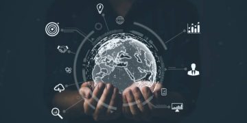 Hands holding a digital globe surrounded by global business icons. Goenvi Technologies. - Supply Chain News