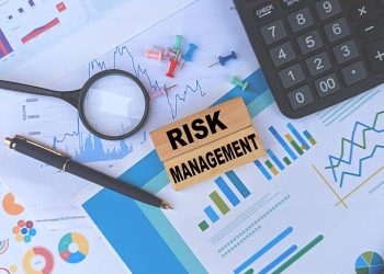 Risk Management concept with charts, calculator, magnifying glass, and pen - Supply Chain News