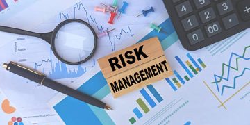 Risk Management concept with charts, calculator, magnifying glass, and pen - Supply Chain News